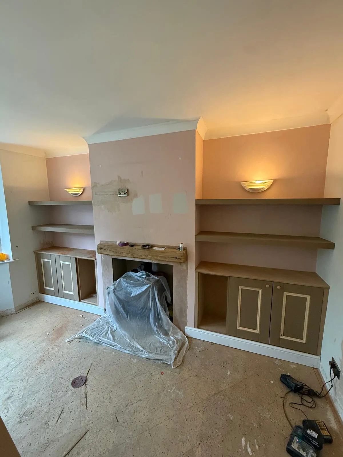 Fireplace alcove shelving and cabinets with rustic solid wood mantelpiece